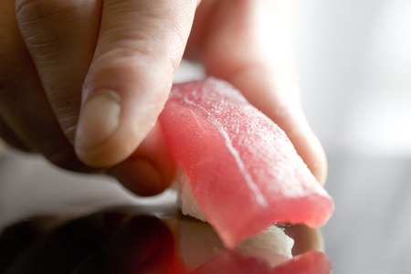 Japanese chef cooking tuna sushiの写真素材