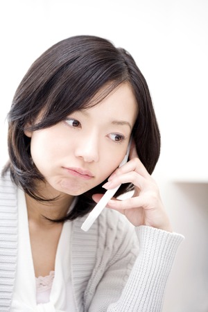 Woman talking on the phoneの写真素材