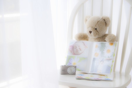 Teddy bear and photo albumsの写真素材