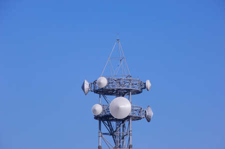 A antenna tower and sunny blue sky.の写真素材
