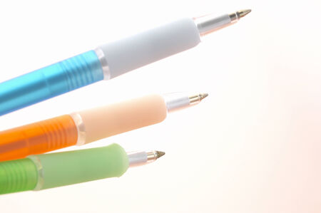 Three color's ballpoint pens and white background.の写真素材