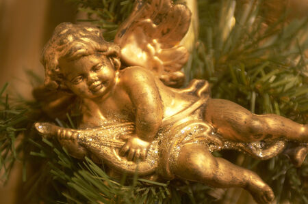 A gold angel ornamental for Christmas decoration.の写真素材