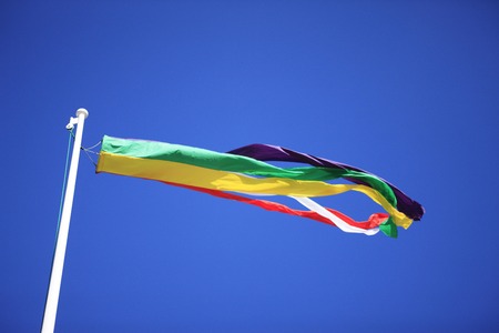 A colorful streamer and sunny blue sky.の写真素材