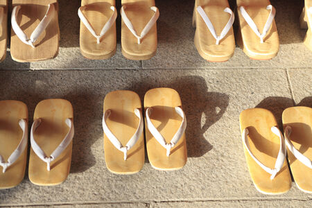 A lot of Japanese wooden clogs are in line.の写真素材