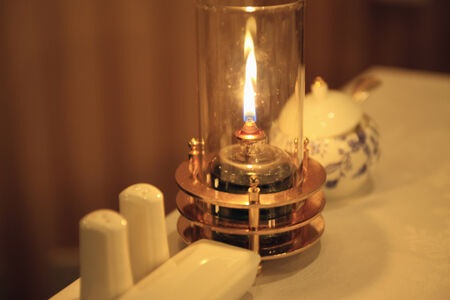 A flame of lamp on the table.の写真素材