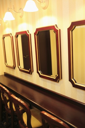 Mirror in the powder room and chair.の写真素材