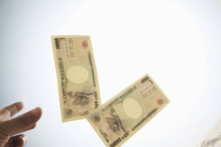 Some paper money and white background.の写真素材