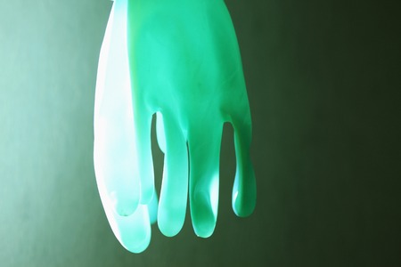 A rubber glove and black background.の写真素材