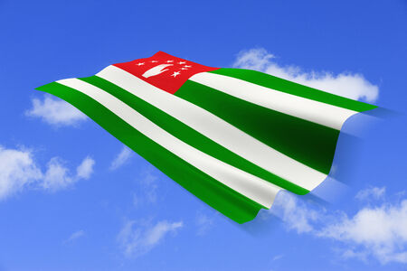ABUHAJIA national flag and blue sky background.の写真素材