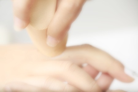 The hand doing nail art.の写真素材