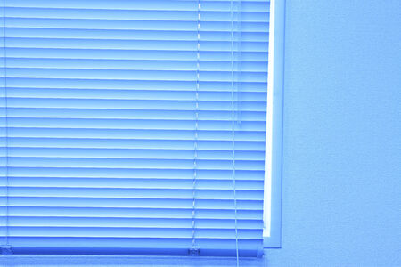 The surface of the blue blind curtain.の写真素材