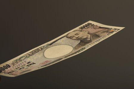 A Japanese paper money and black background.の写真素材