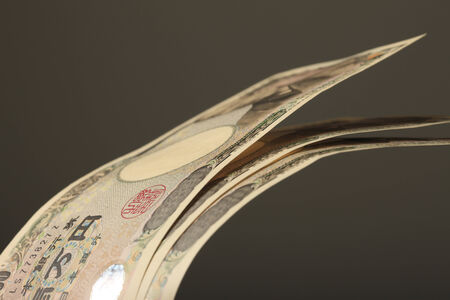 Three Japanese paper money and black background.の写真素材