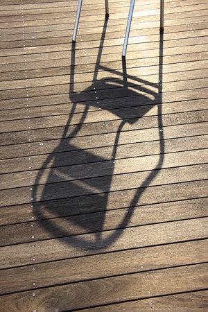The shadow of the chairの写真素材