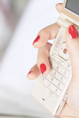 Women and mobile nail polishの写真素材