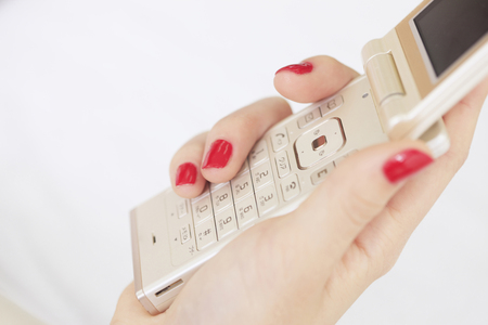 Women and mobile nail polishの写真素材