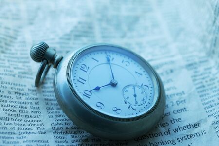 Pocket Watch and newspaperの写真素材