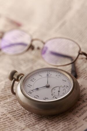 Pocket watch and glasses