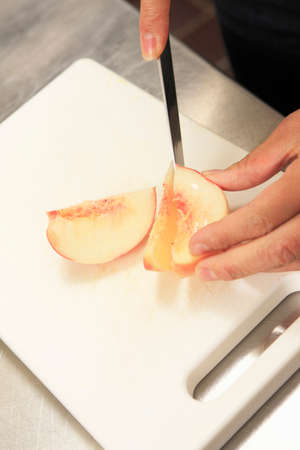 Cutting peachの写真素材