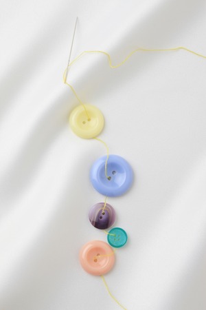 Buttons and thread and needles
