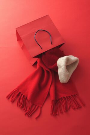 Red scarf and hat and paper backの写真素材