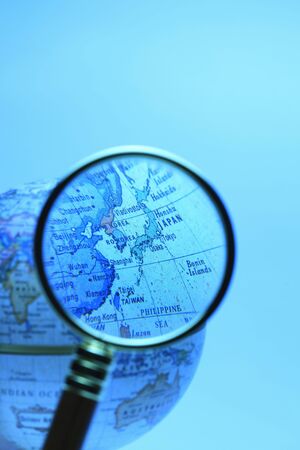 Globe and magnifying glassの写真素材