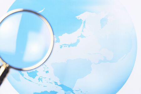 Map and magnifying glassの写真素材