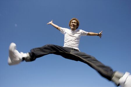 Japanese man jumpingの写真素材