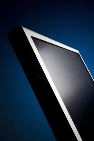 Monitor isolated on blue backgroundの写真素材