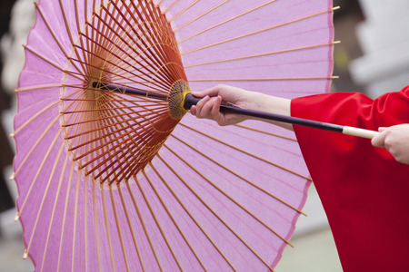 Hand of woman kimono figure to refer to Japanese umbrellaの写真素材