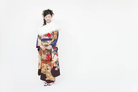 Woman smiling in furisode kimonoの写真素材