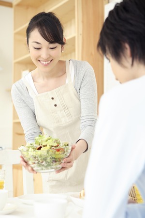 Housewife carrying a cuisineの写真素材