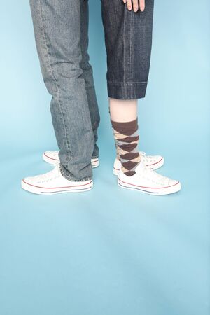 Feet of back-to-back couple