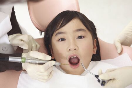 Children to receive dental treatmentの写真素材