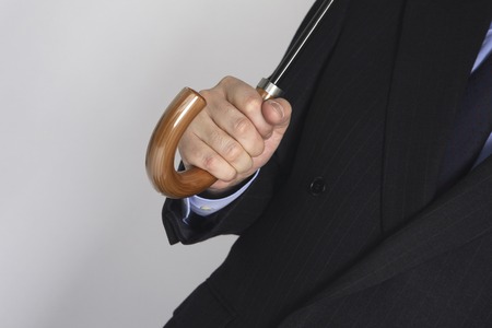 Businessman with an umbrellaの写真素材