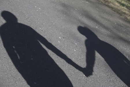 Shadow of the connected couple handsの写真素材