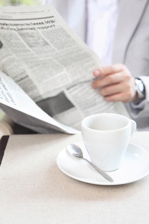Businessman image Read newspaperの写真素材