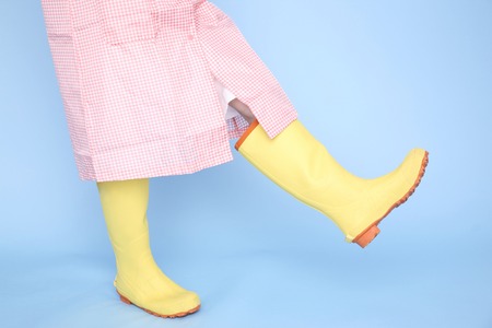 Feet of women who walk wearing bootsの写真素材