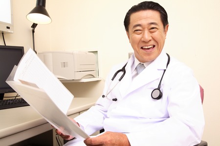 Doctor to speak while having a medical recordの写真素材
