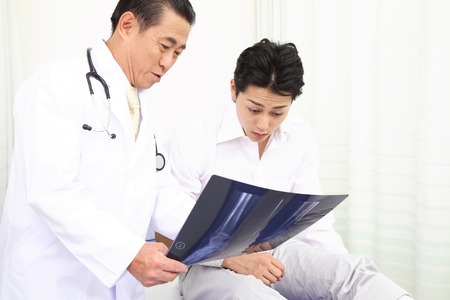 Doctor to show the X-ray to the patient