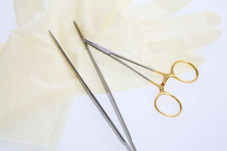 Needle holder and tweezers and rubber gloves