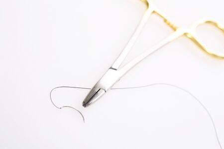 Needle holder and needle and threadの写真素材