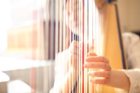 Woman playing the harp
