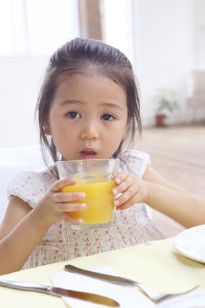 Girl drinking juiceの写真素材