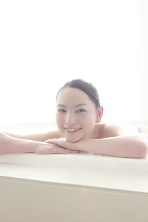 Woman relaxing in a bathの写真素材