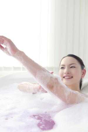 Women wash the body in bubble bath