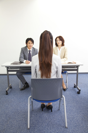 Interview of businessman and OLの写真素材