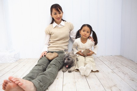 Portrait of mother and child and the dogの写真素材