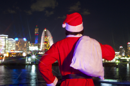Back view of a man who dressed as Santa Clausの写真素材