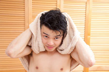 Men wipe the hair with a towelの写真素材